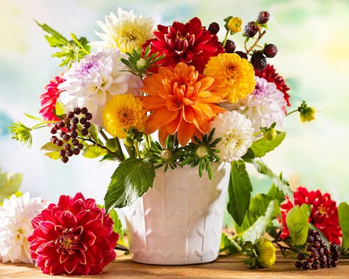 A warm floral arrangement, bursting with color