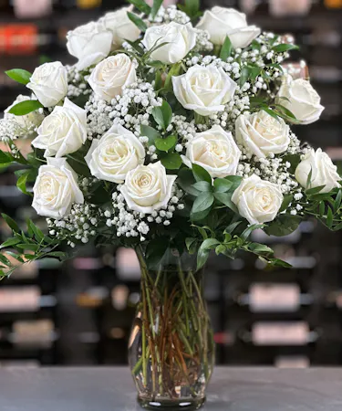 18 white roses with baby's breath delivered by columbus ohio florist Griffins Floral