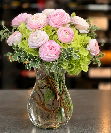 Blush pink ranunculus and green hydrangea arrangement in modern glass vase – Columbus Ohio florist