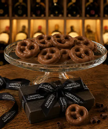 Handcrafted Ohio Amish chocolate-covered Dutch pretzels in premium milk and dark chocolate gift boxes.