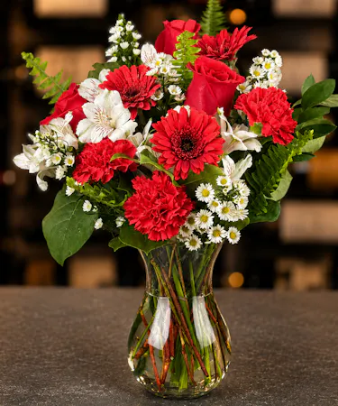 Crimson Delight Tiffany Collection with red roses, gerbera daisies, carnations, and white blooms delivered in Columbus Ohio.