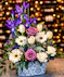 Mom&rsquo;s Paisley Garden bouquet featuring lavender roses, white gerbera daisies, tulips, iris, and carnations in a decorative blue and white paisley tin by Griffins Floral Design