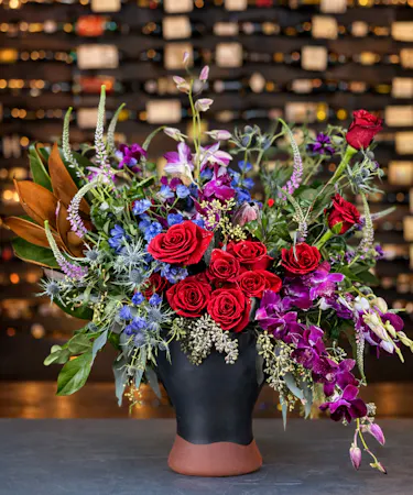 Royal Paradise Luxe red rose and orchid luxury arrangement delivered in Columbus, Ohio.