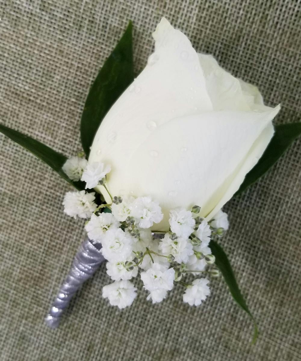 Wedding corsage buttonholes Rose babies breath with colour variations 
