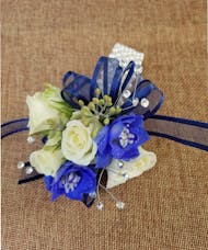 White Roses with blue accent Wrist Corsage