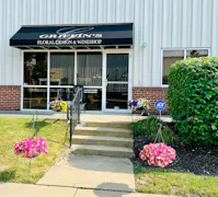 The barn door exterior of our Flower and Wine Shop